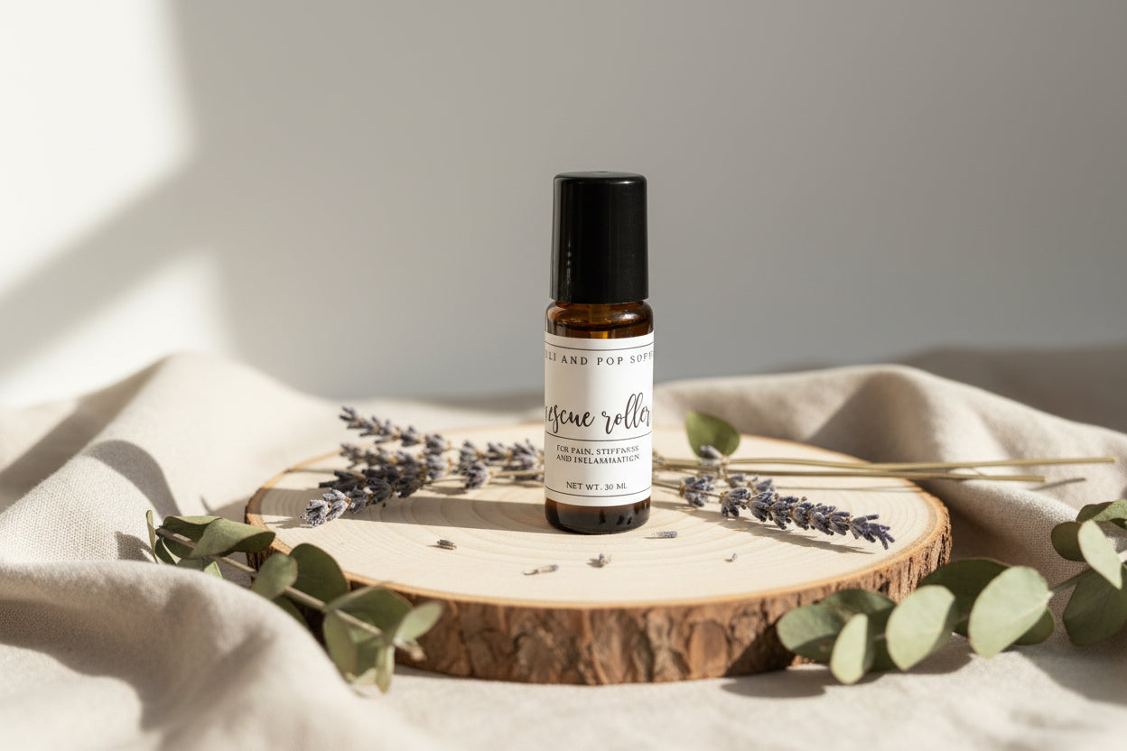 Row of small jars and bottles with labels on a wooden shelf.