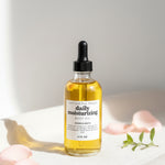 Bottle of daily moisturizing serum with dropper on a light background