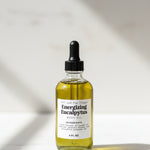 Set of skincare product bottles on a wooden surface with a dark background