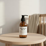 Bottle of 'sweet dreams' baby oil on a light background