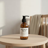 Bottle of 'sweet dreams' baby oil on a light background